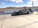 Driving Lamborghini racecars on the track.